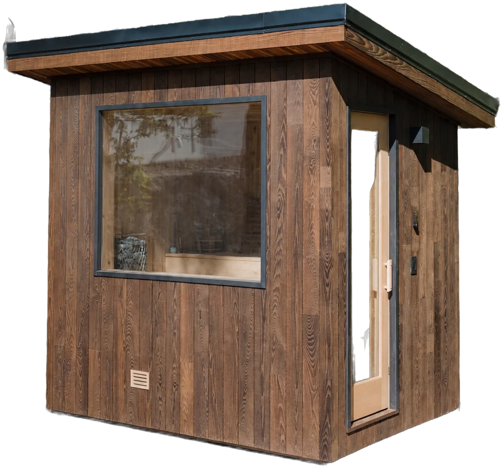 The Kota: a compact sauna in brown vertical wood siding with a large viewing window and a glass door